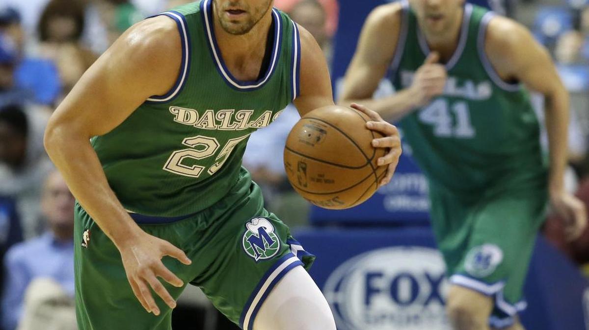 Mavericks forward Chandler Parsons, left, who had nine points, and Dirk Nowitzki surged past the Jazz on Friday night with a 35-17 second-quarter run.
