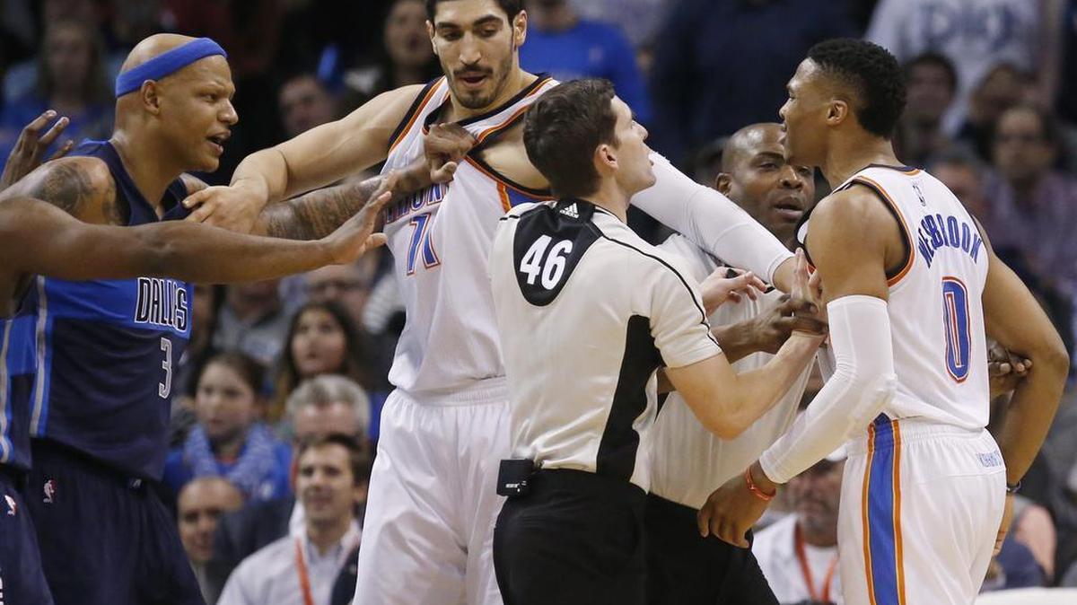 Officials separate Dallas Mavericks forward Charlie Villanueva, left, and Oklahoma City Thunder guard Russell Westbrook (0), with help from Thunder center Enes Kanter, during an altercation in the second quarter .