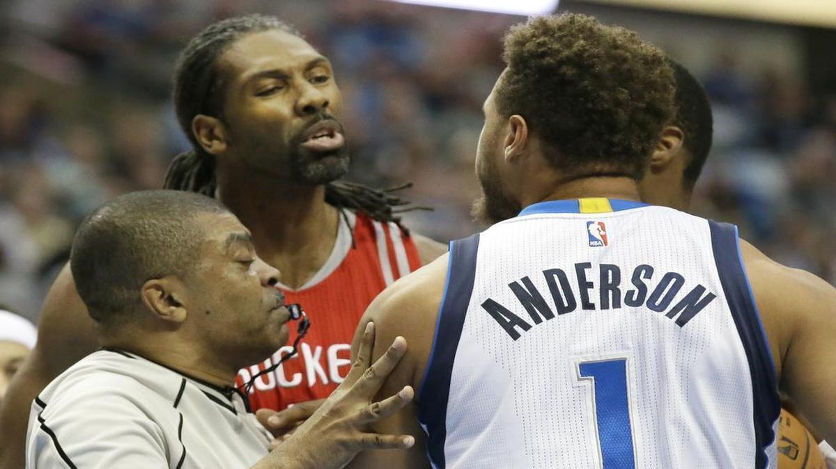 Rockets center Nene, left, and Mavericks guard Justin Anderson exchange barbs, which turned out to be the norm in Tuesday’s chippy game marred by eight technical fouls.