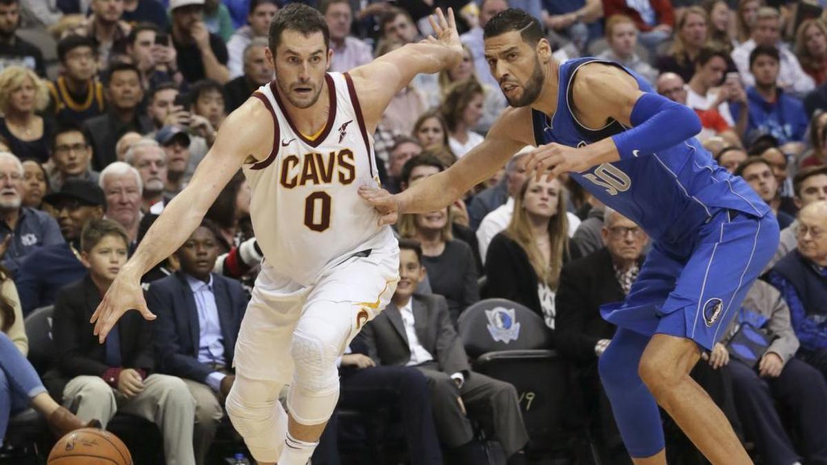 Cavaliers forward Kevin Love drives past Mavericks center Salah Mejri in Cleveland’s 111-104 victory over Dallas on Saturday.