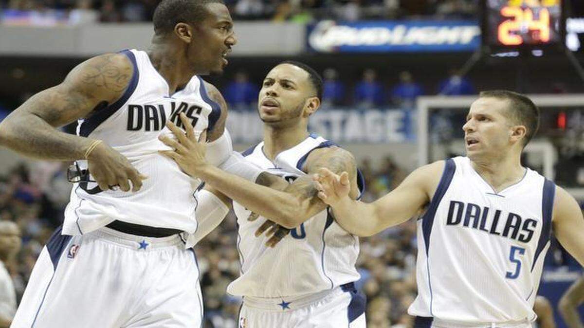 
Dallas Mavericks center Amar’e Stoudemire, left, being restrained by teammates Devin Harris and J.J. Barea, will have a homecoming of sorts when the Mavs visit Phoenix on Sunday. Stoudemire played with the Suns for eight seasons. On Friday night, Stoudemire was ejected after drawing two technical fouls. 
