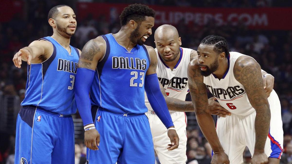 Dallas Mavericks’ Wesley Matthews (23) and Devin Harris, left, exchange words with Los Angeles Clippers’ Marreese Speights (5) and DeAndre Jordan (6) during the first half of an NBA basketball game in Los Angeles on Wednesday, April 4, 2017.