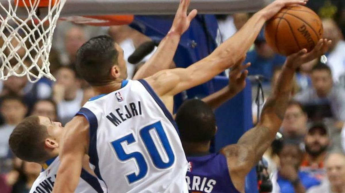 Mavericks center Salah Mejri blocka shot by Suns foward Markieff Morris earlier this season.