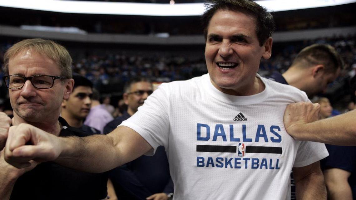Dallas Mavericks owner Mark Cuban high-fives and socializes with fans before a game in February.