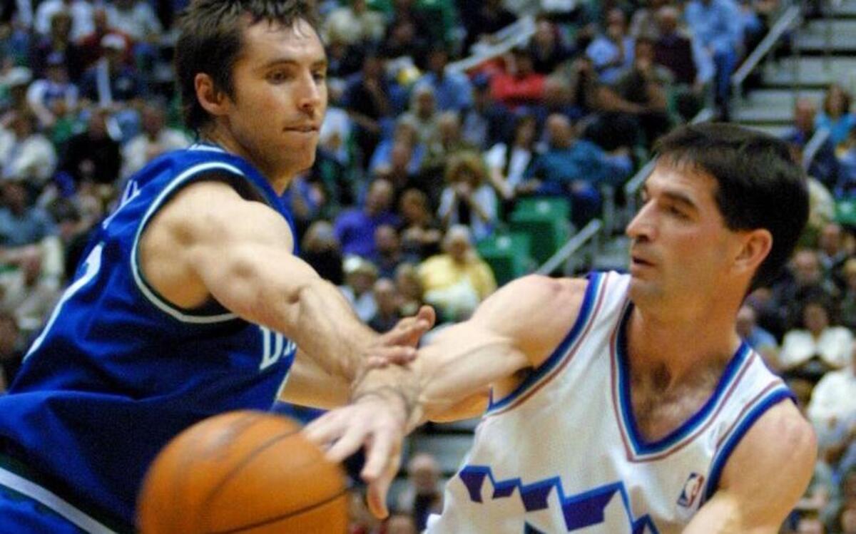 Former Utah Jazz guard John Stockton, left, is the NBA’s all-time leader in assists with 15,806.