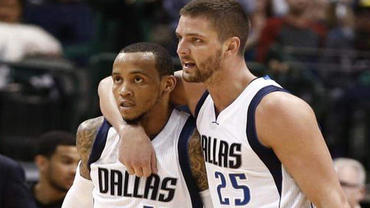 
Dallas Mavericks forward Chandler Parsons throws an arm around guard Monta Ellis after a basket Tuesday in Dallas’ comeback victory over the Spurs. Ellis had 38 points in that game, but he was injured Friday night at San Antonio in the Spurs’ victory. 
