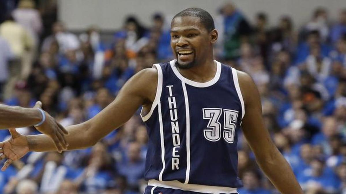 Oklahoma City Thunder forward Kevin Durant, right, celebrates a basket with teammate Dion Waiters in Game 3. Durant was assessed a technical foul Friday for an incident in Thursday’s game.