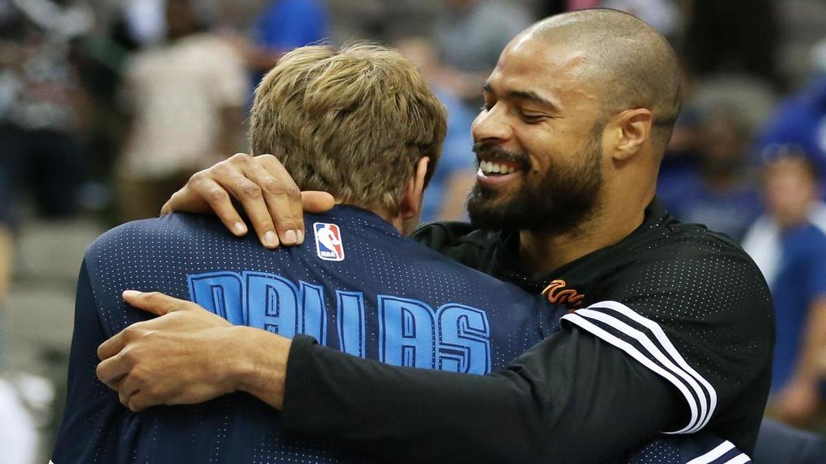 Phoenix Suns center Tyson Chandler, right, give a warm greeting to his former teammate Dirk Nowitzki of the Dallas Mavericks before a preseason game last week.