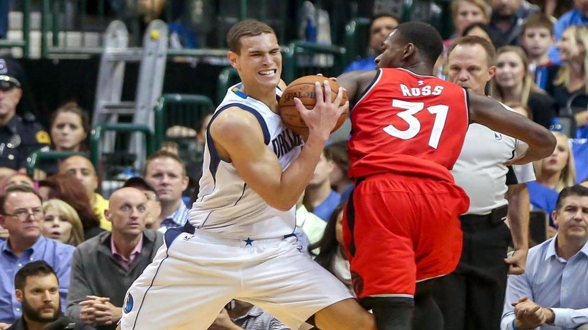 Dwight Powell, left, has had at least seven rebounds in five of the six games the Mavericks have played this season.