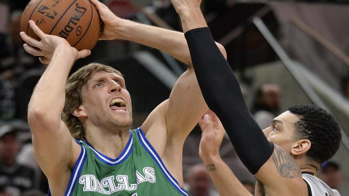 Mavericks forward Dirk Nowitzki was held to four points on 2-for-10 shooting Sunday night against Danny Green and the Spurs.