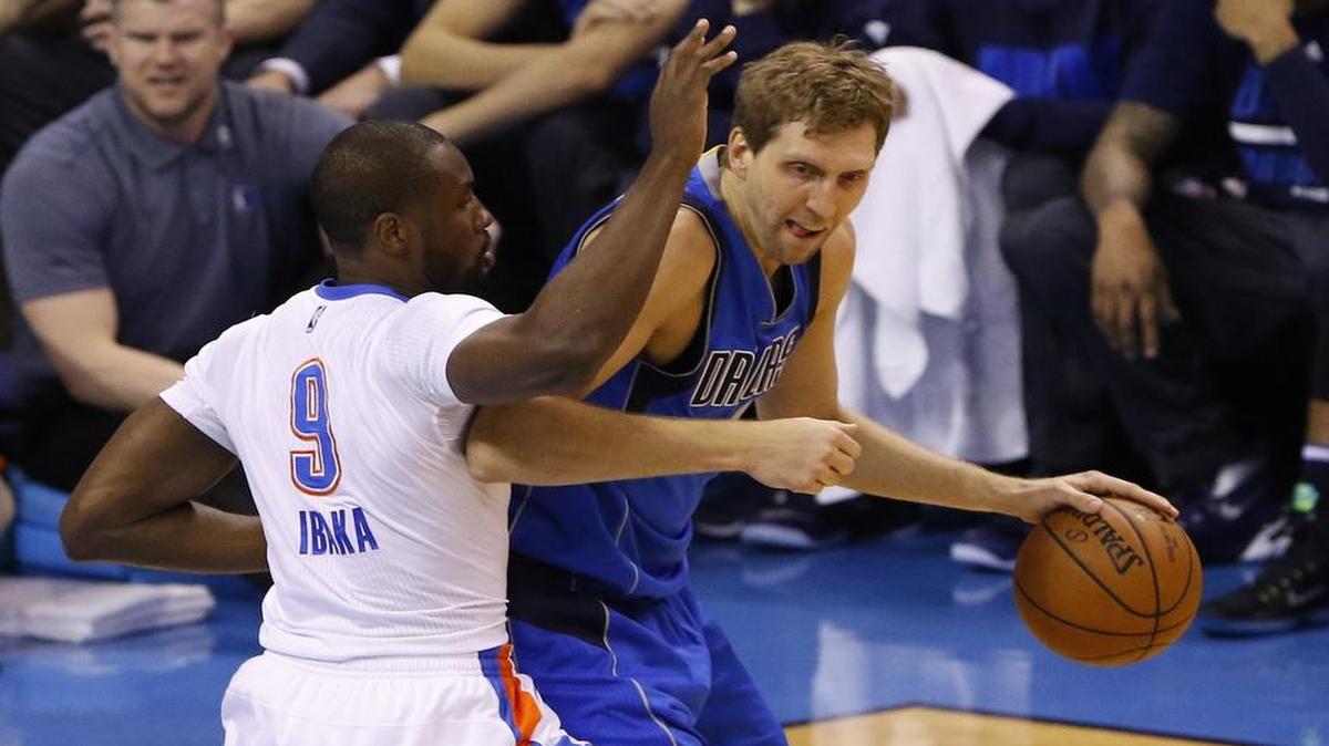Dirk Nowitzki, right, working against Thunder forward Serge Ibaka, sustained a bone bruise early in Game 2 but was able to play 38 minutes and contribute 17 points and four rebounds.