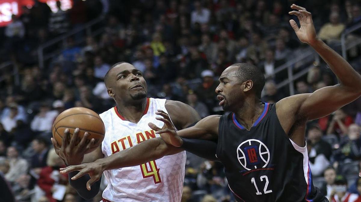 Forward Paul Millsap, left, driving against the Clippers’ Richard Mbah a Moute on Wednesday, averages 18 points and 8.8 rebounds to lead the Hawks into Monday’s game against the Mavericks.