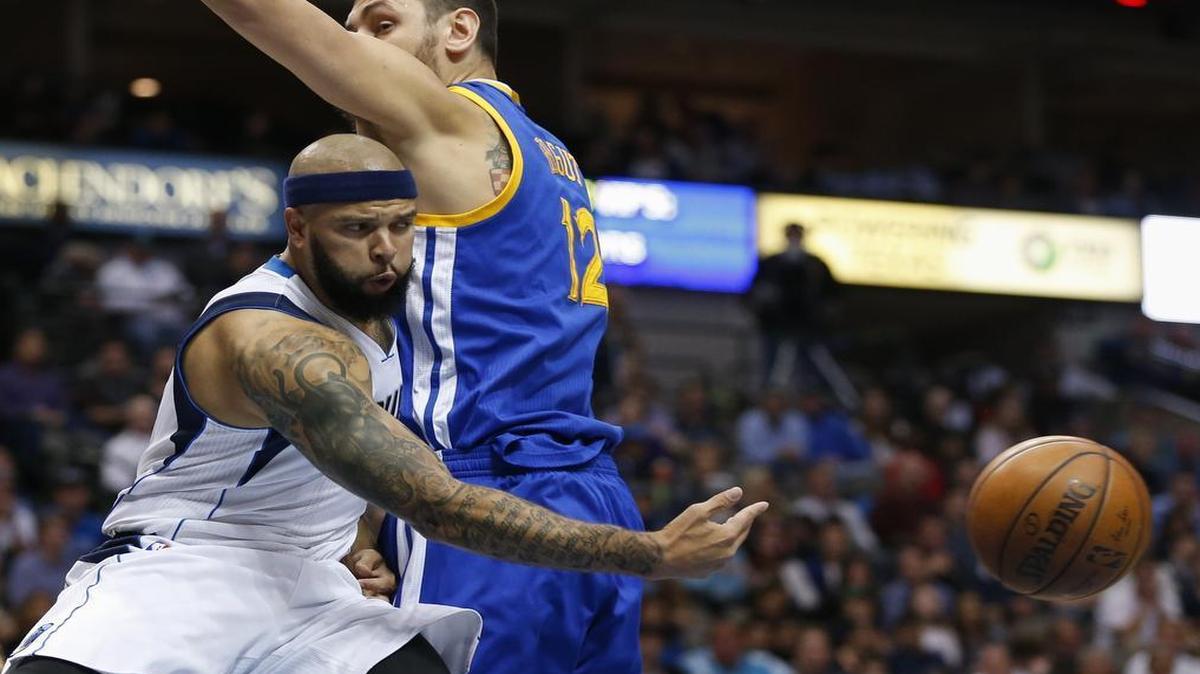 Mavericks guard Deron Williams (8) passes the ball around Warriors center Andrew Bogut (12) Friday night. Williams and the Mavericks have lost seven of eight games and will be looking to get back on track with two crucial games against the Trail Blazers starting Sunday afternoon in Dallas.