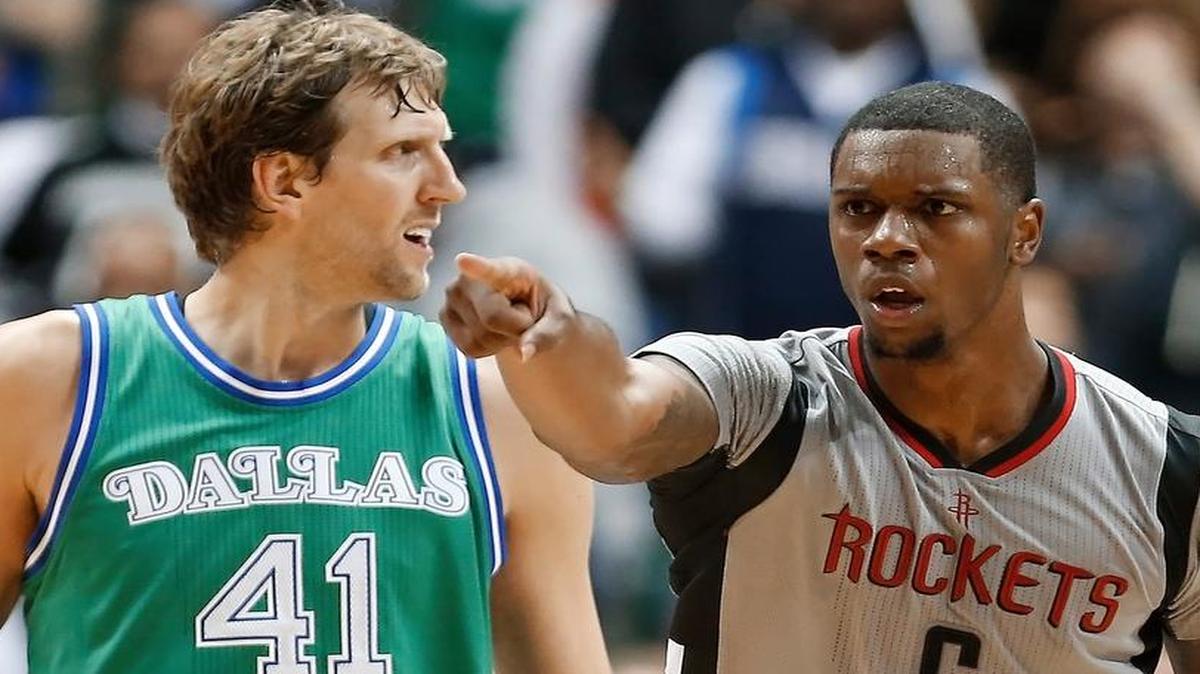Dallas Mavericks forward Dirk Nowitzki (41) looks on as Houston Rockets forward Terrence Jones (6) celebrates a dunk during the second half Friday, in Dallas. Houston won 100-96.