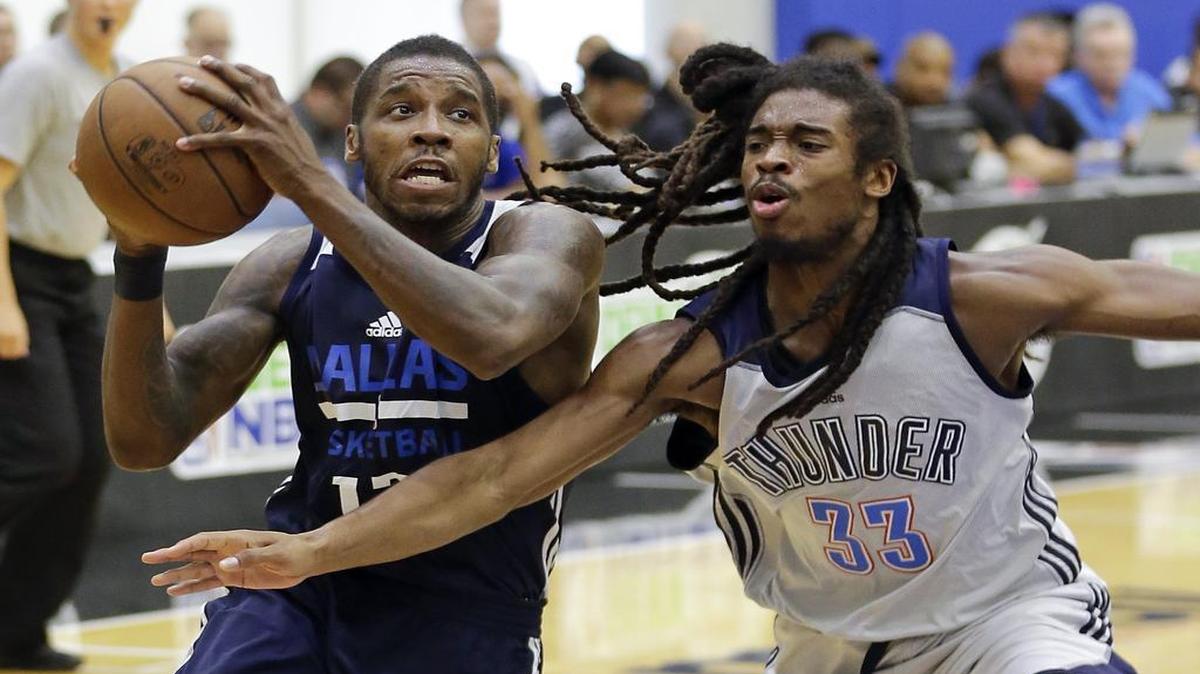 Mavericks guard Dwight Buycks, left, drives against Oklahoma City’s Marcus Thornton during Wednesday’s game in Orlando, Fla. Buycks scored 11 points, one of five Mavericks to score in double figures in the 96-75 victory.
