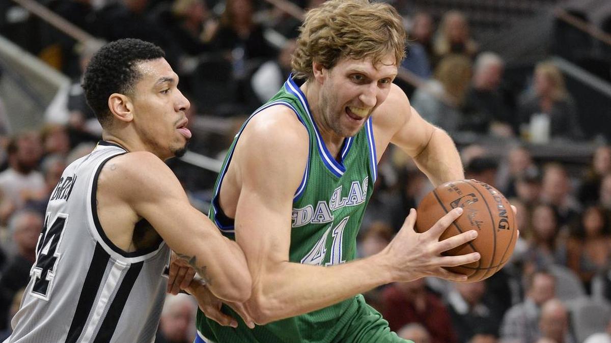 Mavericks forward Dirk Nowitzki, right, shot just 2-of-10 from the field Sunday in a 112-83 loss to Danny Green and the San Antonio Spurs.