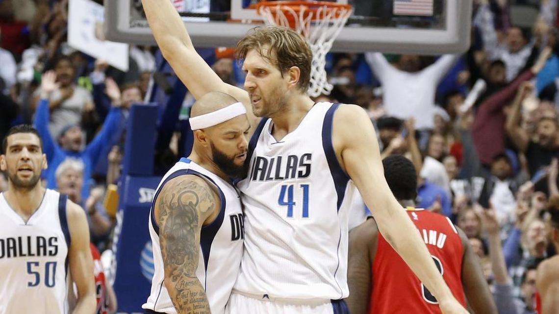 Mavericks forward Dirk Nowitzki, right, scored eight straight points in overtime, all on assists by point guard Deron Williams.
