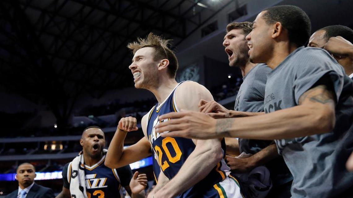 Gordon Hayward celebrates his game-winning shot at the overtime buzzer with Jazz teammates.
