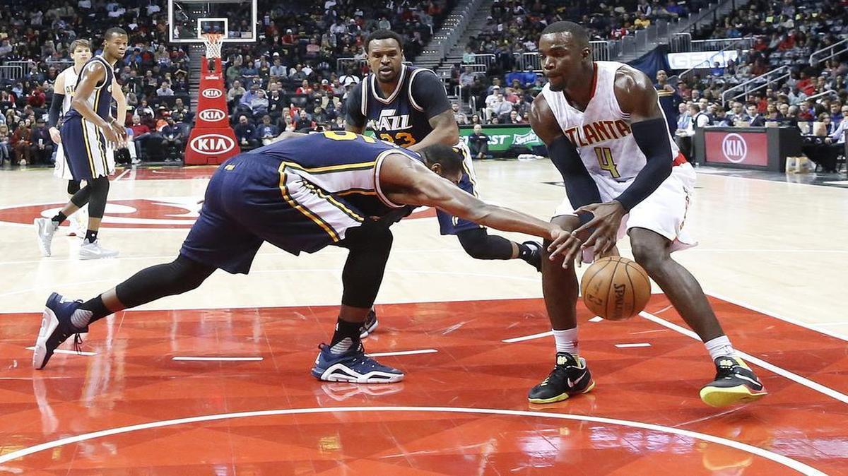 Jazz forward Derrick Favors, left, nearly averages a double-double every game, with 16 points, and 9.3 rebounds.