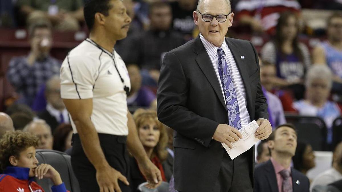 NBA referee Bill Kennedy, left, next to Kings coach George Karl during a Nov. 27 game, told Yahoo Sports that he is gay.