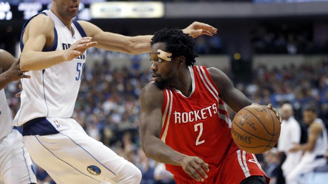 Houston Rockets guard Patrick Beverley (2) tries to drive to the basket as Dallas Mavericks center Salah Mejri, left, defends during the first half of an NBA basketball game, Wednesday, April 6, 2016, in Dallas.