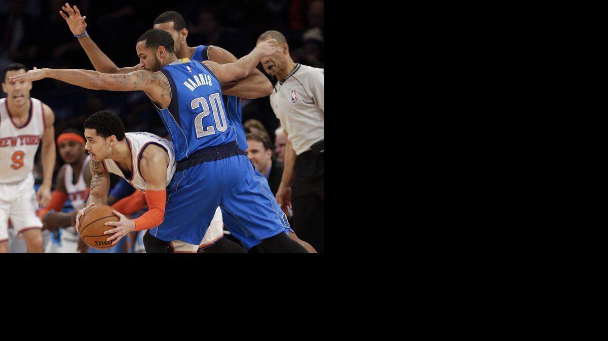 
Mavs guard Devin Harris defends against Knicks guard Shane Larkin, who was part of the Tyson Chandler trade.



