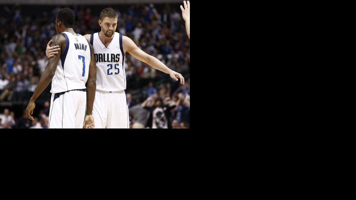 
Chandler Parsons, right, is making progress, but is still experiencing pain in his right knee.


