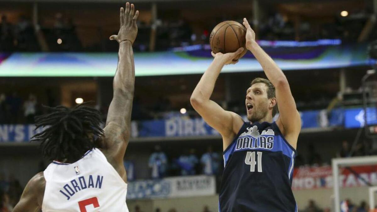 Mavericks forward Dirk Nowitzki (41) was 5-of-5 from 3-point range against the LA Clippers and DeAndre Jordan in Saturday’s 108-82 Dallas victory.