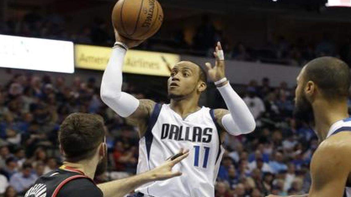 
Dallas Mavericks guard Monta Ellis (11) shoots over Portland Trail Blazers center Joel Freeland during the first half. 
