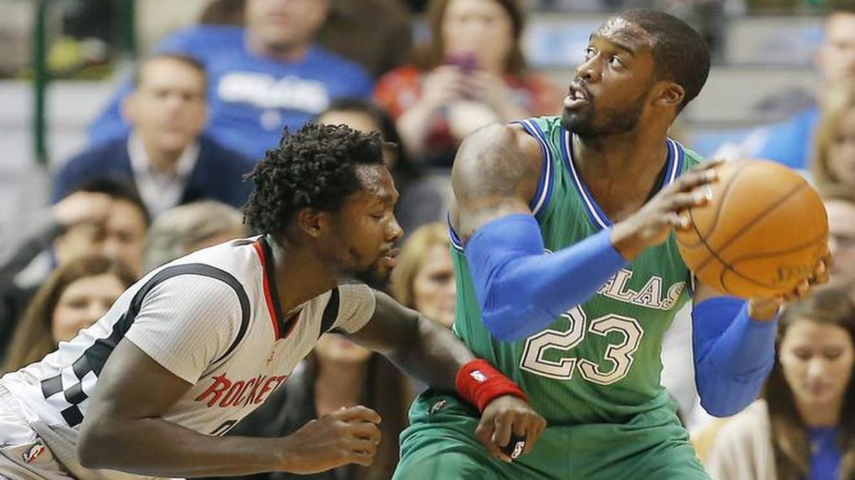 Dallas Mavericks guard Wesley Matthews (23) looks for space against Houston Rockets forward Montrezl Harrell (35) during the first half Friday in Dallas. Houston won 100-96.