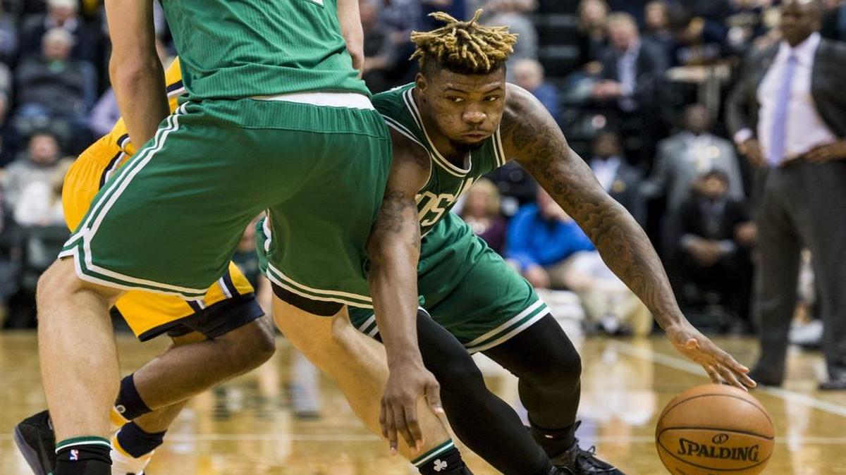 Boston Celtics guard Marcus Smart, right, a graduate of Flower Mound Marcus High School, is averaging 13 points and four rebounds a game in the early stages of his third NBA season. Smart will get to play against his hometown team, the Dallas Mavericks, at 6:30 p.m. Wednesday on FSSW.