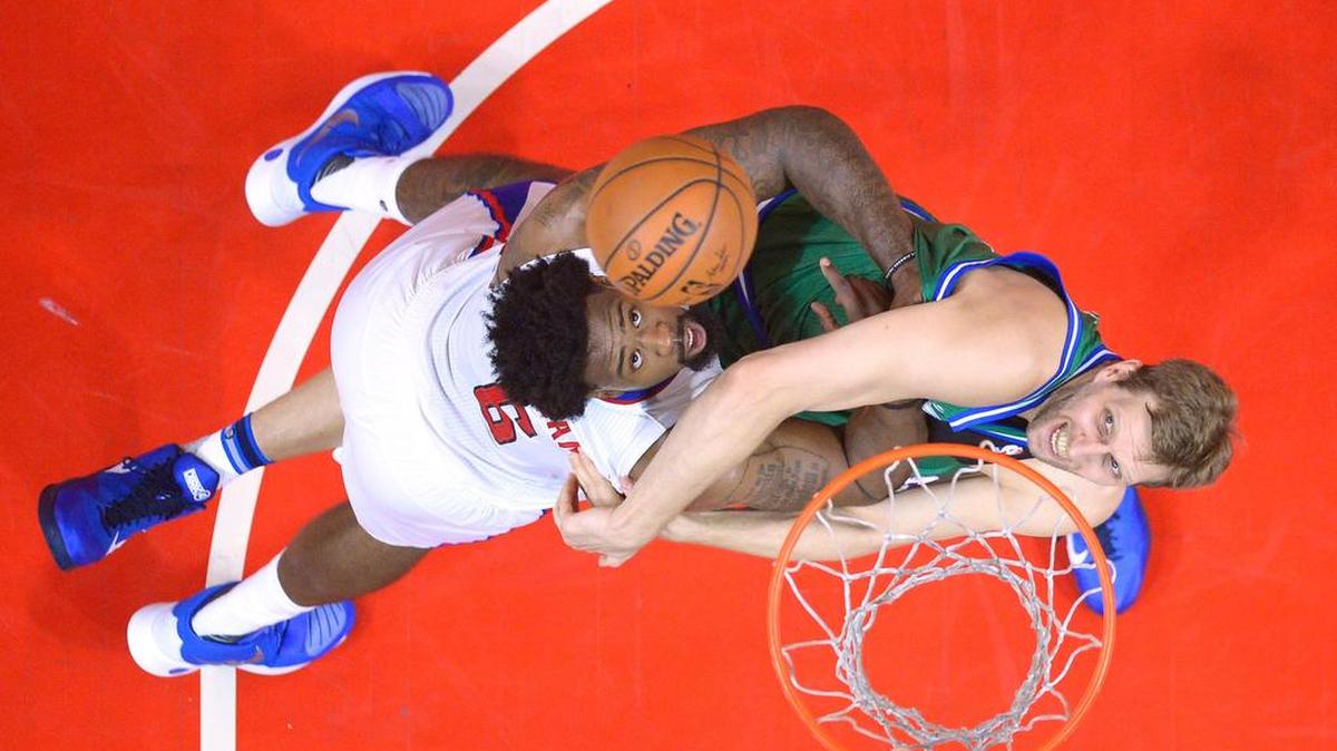 Los Angeles Clippers center DeAndre Jordan, left, and Dallas Mavericks forward Dirk Nowitzki battle for a rebound during the first half.