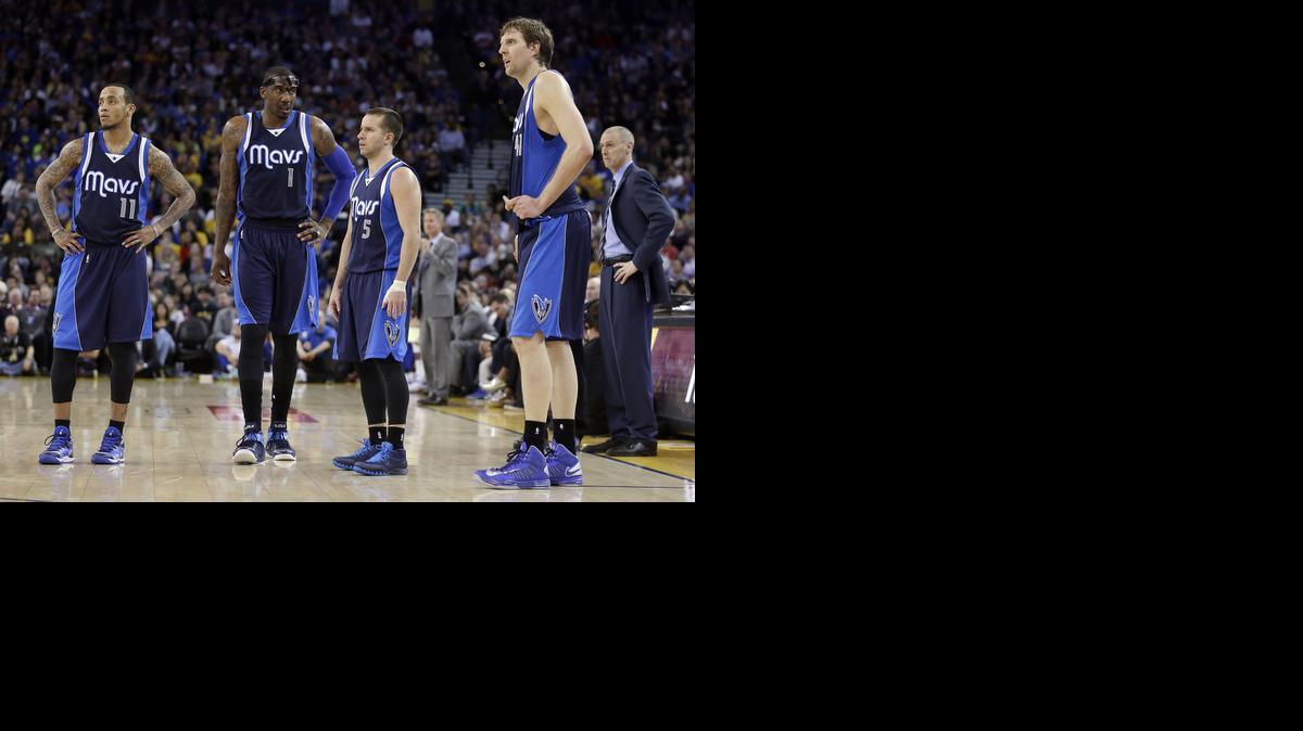 
Dallas Mavericks players Monta Ellis, Amare Stoudemire, J.J. Barea, Dirk Nowitzki, and coach Rick Carlisle, from left, wait for the Golden State Warriors to shoot after a technical foul was called against Nowitzki during the second half Friday in Oakland, Calif. The Warriors won 104-89. 
