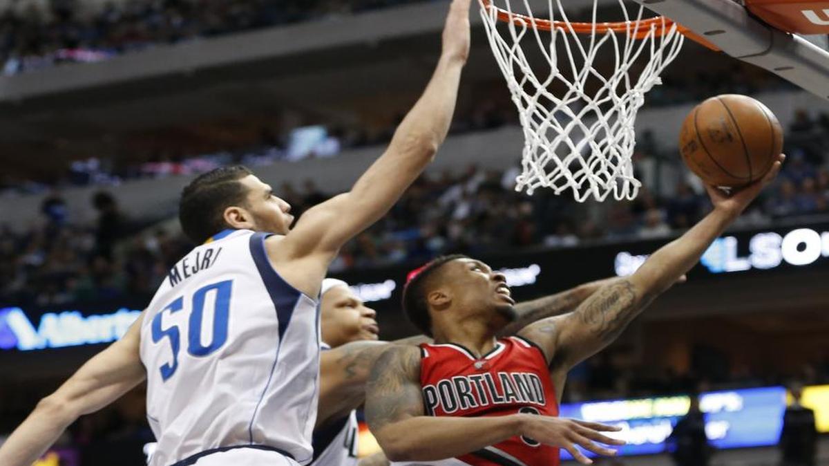 Mavericks center Salah Mejri, left, has produced consecutive double-doubles but will go up against the mighty Warriors on Friday. The game will be televised at 9:30 p.m. on Fox Sports Southwest.