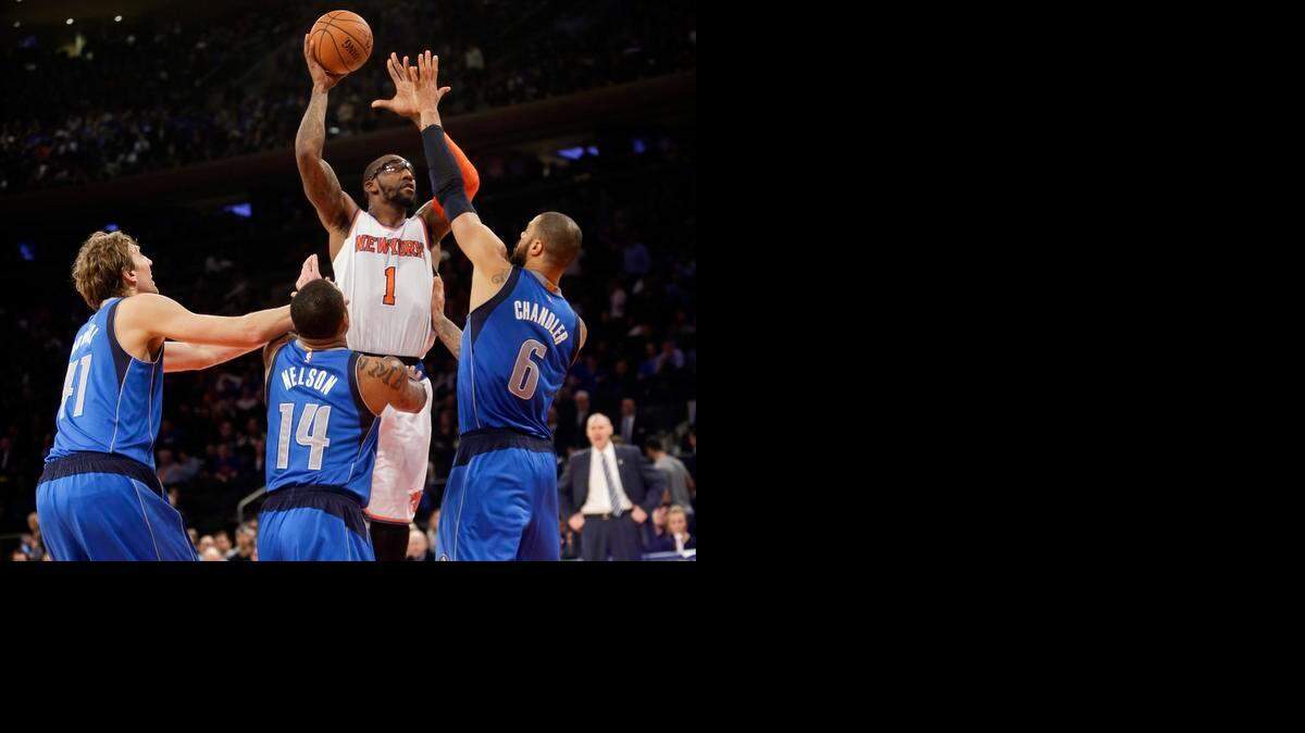 
Tyson Chandler, right, is happy to have Amar’e Stoudemire (1) shooting with him instead of over him.
