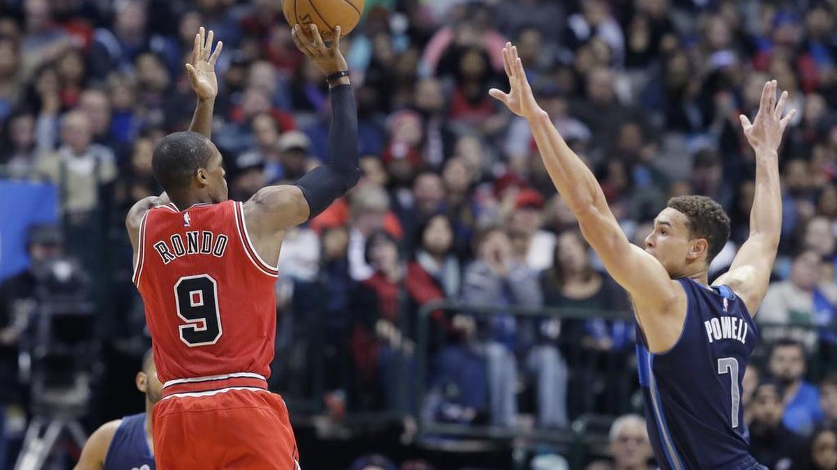 Mavericks forward Dwight Powell, right, had a career-high 17 points Saturday against Rajon Rondo and the Bulls.