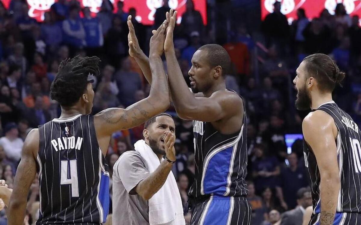 Orlando Magic guard Elfrid Payton (4) and Orlando Magic forward Serge Ibaka (7) react after Ibaka hit the game-winning shot during the final seconds of an NBA basketball game in Oklahoma City, Sunday, Nov. 13, 2016. Orlando won 119-117. Orlando is host to the Dallas Mavericks at 6 p.m. Saturday.