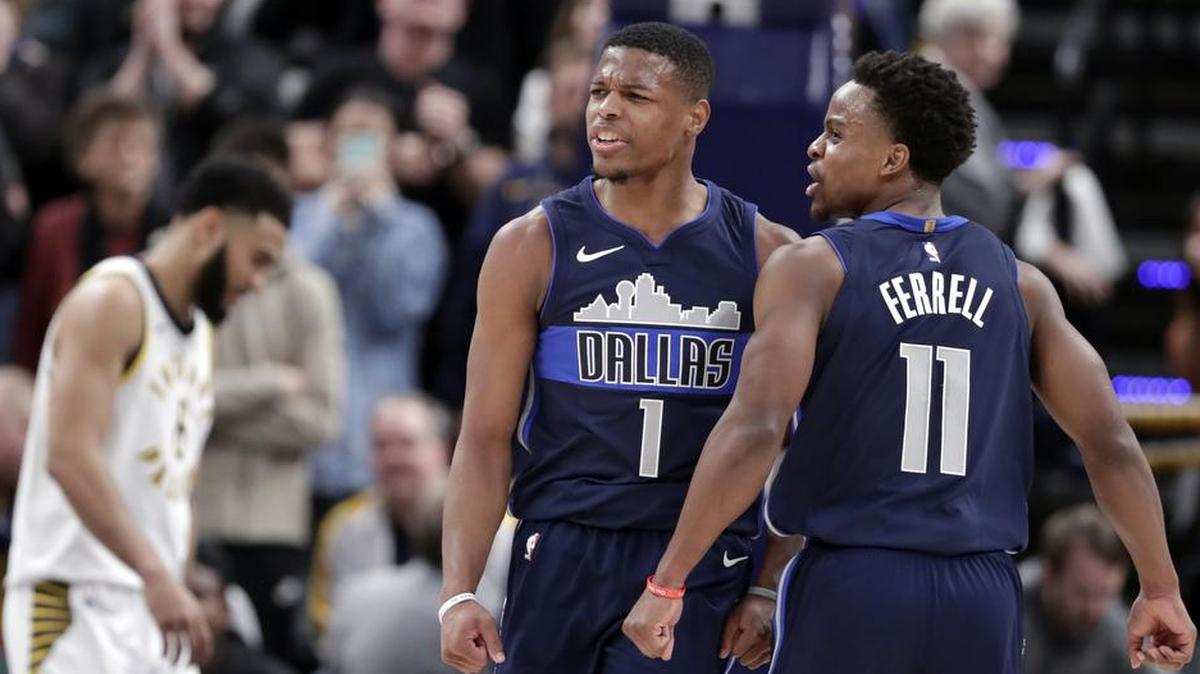 Dallas Mavericks guards Dennis Smith Jr. (1) and Yogi Ferrell (11) celebrate during the closing minute of the team's NBA basketball game against the Indiana Pacers in Indianapolis, Wednesday, Dec. 27, 2017. The Mavericks defeated the Pacers 98-94.