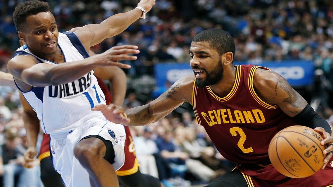 Cleveland Cavaliers guard Kyrie Irving (2) looks for space against Dallas Mavericks guard Yogi Ferrell (11) during the first half Monday in Dallas.