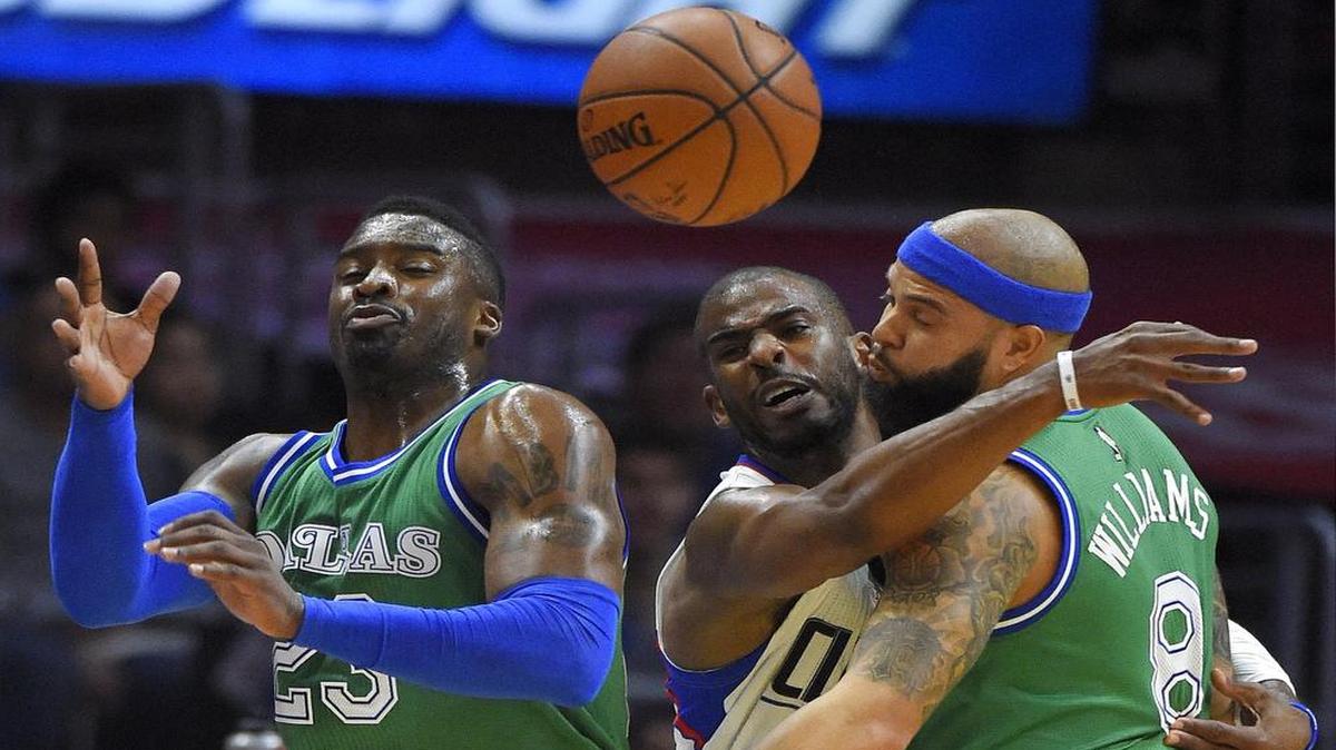 Mavericks guard Deron Williams, right, working against Clippers guard Chris Paul on Sunday, scored 15 points with four rebounds and three assists.