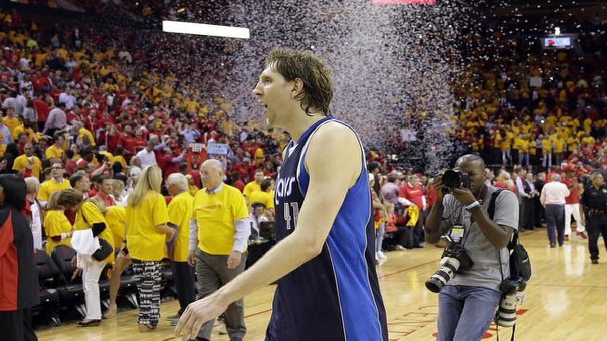 
Mavericks forward Dirk Nowitzki leaves the court following Game 5 in the first round of the playoffs against the Houston Rockets. Nowitzki says he would consider coming off the bench if it could help bring in players to elevate the Mavericks back to title contention. ,

