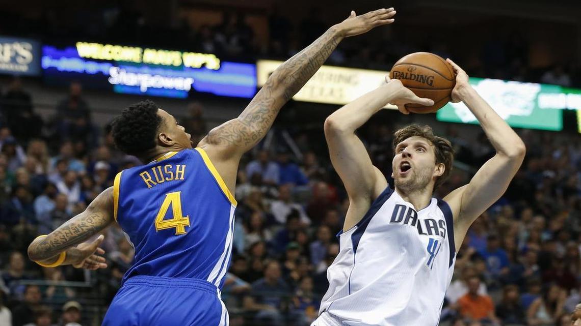 Mavericks forward Dirk Nowitzki, right, shoots over Golden State’s Brandon Rush on March 18 at American Airlines Center. He scored 24 points in that game, but has struggled to find his shooting touch since sitting out against the Warriors on March 25.