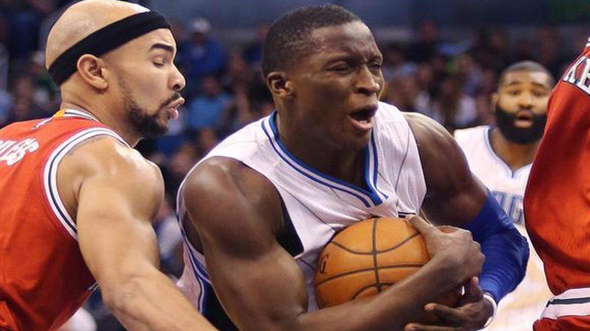 
The Orlando Magic’s Victor Oladipo, middle, hugging the ball against Milwaukee, averages 16.6 points a game but had 32 in Orlando’s last victory.
