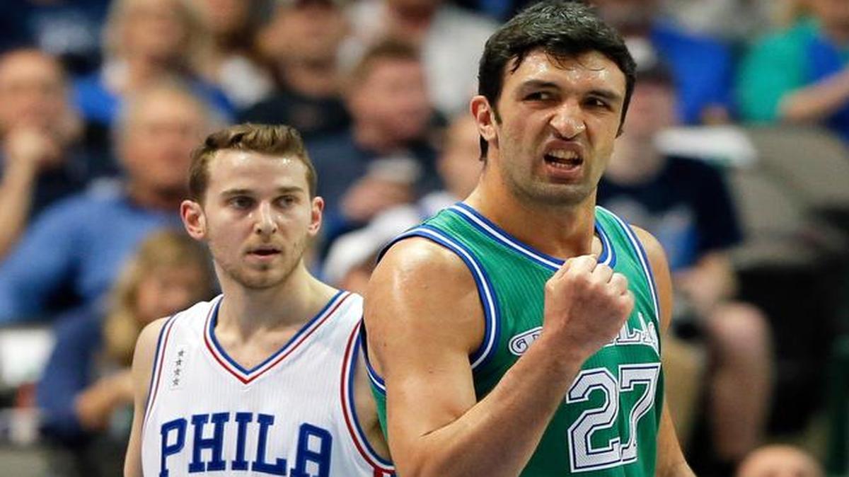 Dallas Mavericks center Zaza Pachulia, right, celebrates sinking a basket in the first half against the 76ers.