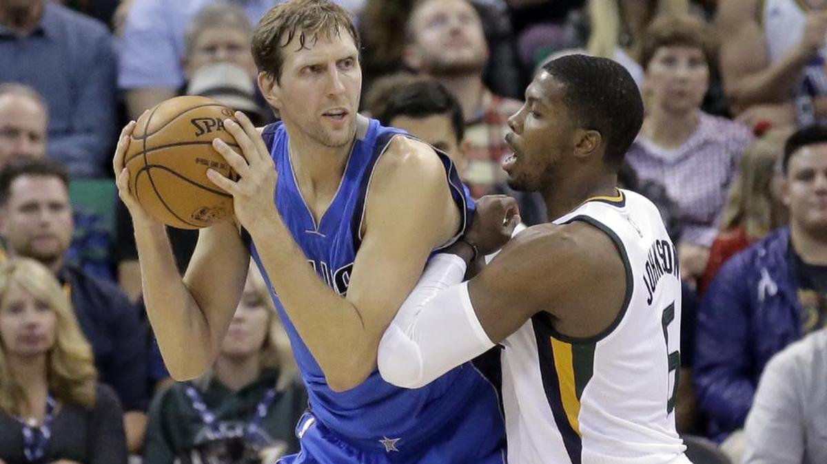 Dallas Mavericks forward Dirk Nowitzki, left, is averaging 15.5 points in the two games he’s played this season, his 19th in the NBA.