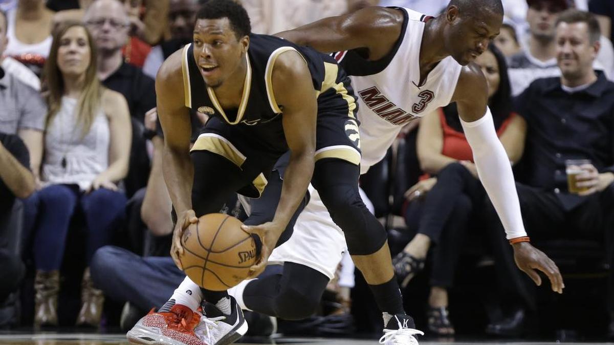 Raptors guard Kyle Lowry, left, grabbing a loose ball from the Heat’s Dwyane Wade on Friday, is averaging 21 points, 5.9 assists and 2.3 steals.