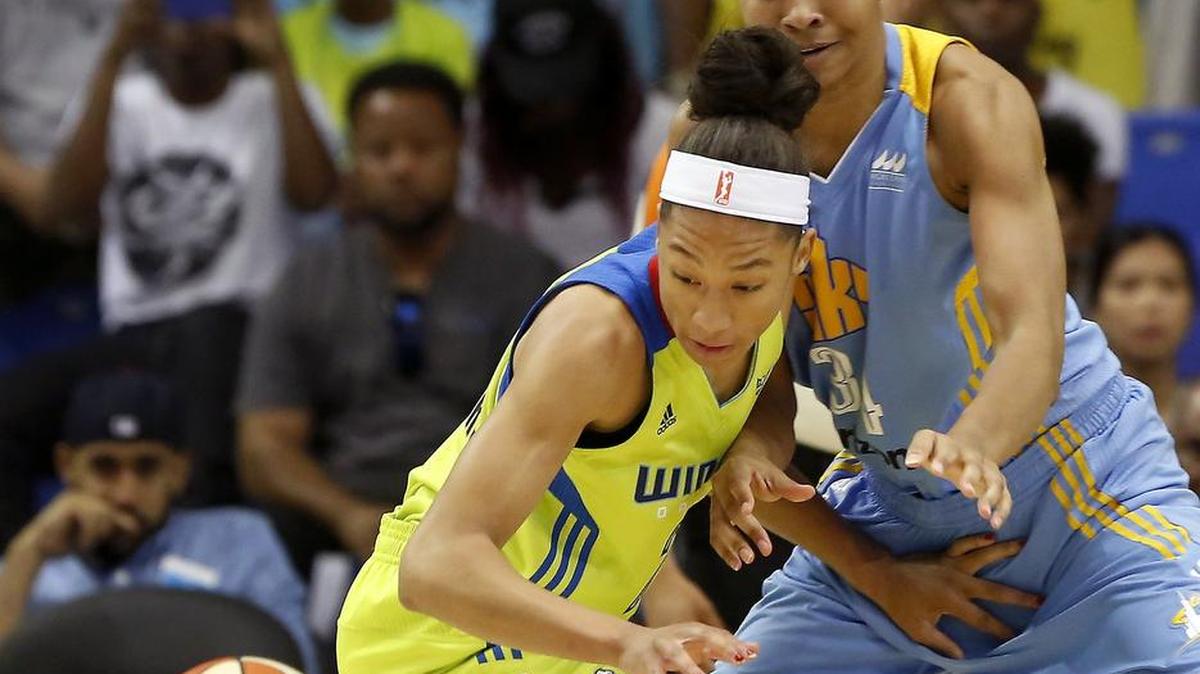 Dallas Wings forward Aerial Powers, left, makes a steal against Chicago Sky center Imani Boyette, a rookie from Texas, at College Park Center in Arlington, Texas on May 29.