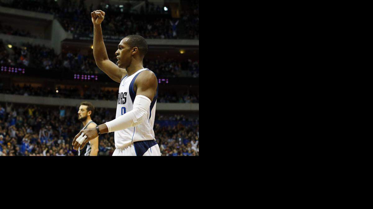 
Dallas Mavericks guard Rajon Rondo (9) after the assist to Monte Ellis during the second half of a NBA basketball game against the San Antonio Spurs at American Airlines Center in Dallas, TX on Dec. 20, 2014. Dallas Mavericks won 99-93. 
