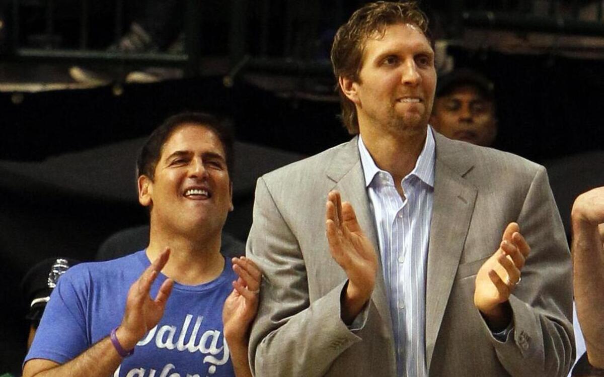 Mark Cuban, left, says he met Mavericks forward Dirk Nowitzki at a Dallas bar the night before Cuban bought the basketball team.