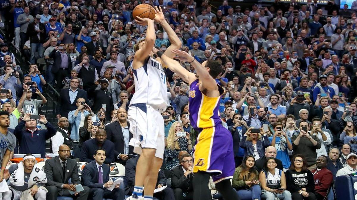 Dirk Nowitzki shoots over Lakers defender Larry Nance Jr. The bucket, just a minute into the second quarter, gave Nowitzki 30,000 career points in the NBA.